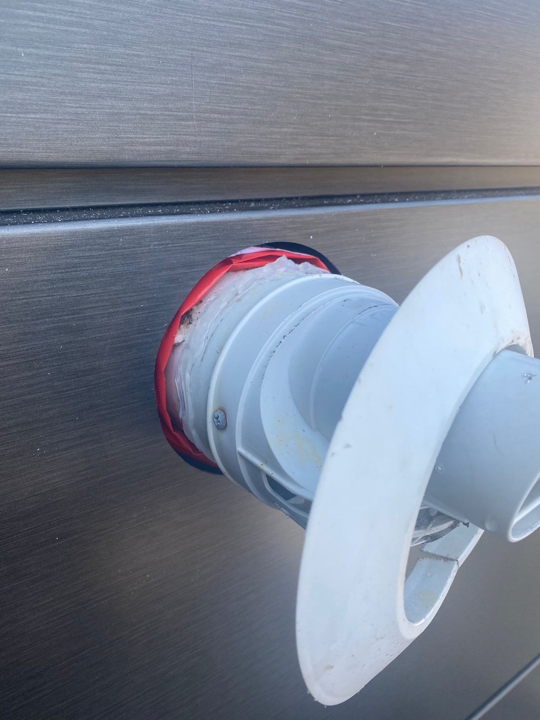 Intumescent fire protection fitted around a façade penetration